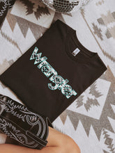 Load image into Gallery viewer, Wrangler Aztec Turquoise Graphic on Gildan Softstyle Black Shirt – Graphic Tee, Long Sleeve & Crewneck.