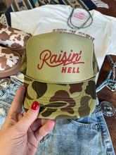 Load image into Gallery viewer, Raisin' Hell Green Camo Trucker Hat