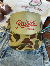 Load image into Gallery viewer, Raisin' Hell Green Camo Trucker Hat