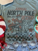 Load image into Gallery viewer, Reindeer North Pole Rodeo Graphic Tee