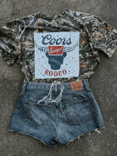 Load image into Gallery viewer, Upcycled Coors Banquet Rodeo Realtree Camo Rework (One-of-One) | Size XL Shirt
