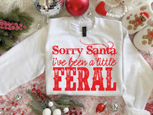 Load image into Gallery viewer, Sorry Santa I’ve Been a Little Feral Christmas Shirt – Graphic Tee, Long Sleeve &amp; Crewneck
