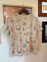 Load image into Gallery viewer, The Sandy Cowboy T-Shirt
