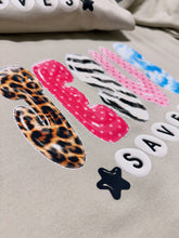 Load image into Gallery viewer, Jesus Saves Graphic Sweatshirt | Christian Crewneck | Leopard Zebra Pink Polka Dot Jesus Sweater

