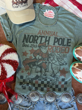 Load image into Gallery viewer, Reindeer North Pole Rodeo Graphic Tee
