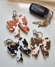Load image into Gallery viewer, 3d Print Puffy Bow Trend Keychain Fringe Cow Print Western Made in America
