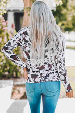 Load image into Gallery viewer, Cow Print Keyhole Long Sleeve Top
